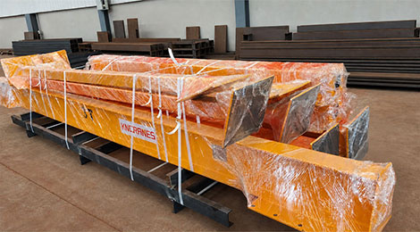 Gantry beams and A-frame legs strapped to a steel transport pallet