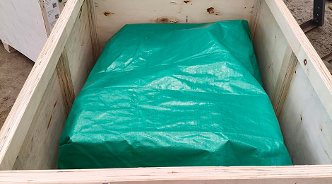 Tarp-lined case — FUMI-FREE marks printed on the plywood