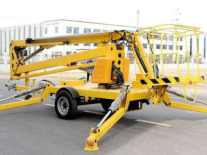 Towable boom lifts