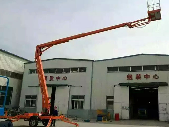 Towable boom lifts