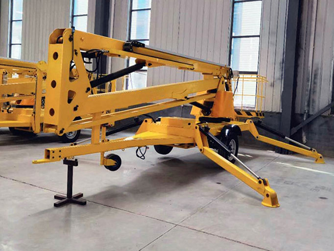 Towable boom lifts