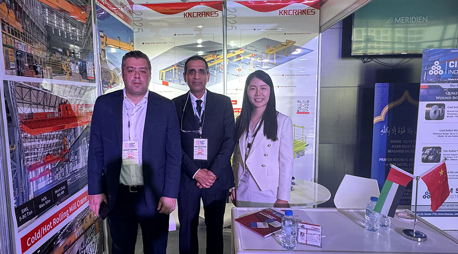 Kinocranes staff interacting with attendees at the Global Steel Summit booth.