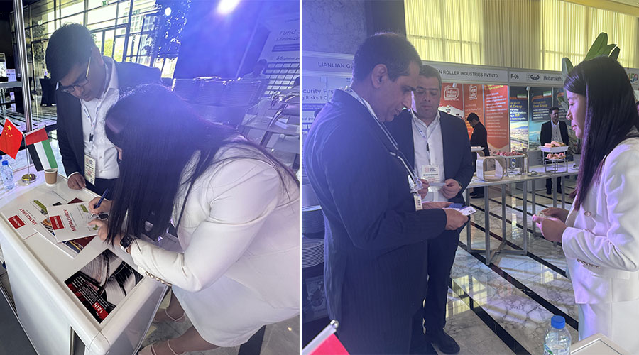 Live interaction at the Kinocranes booth, showing staff engaging with visitors and explaining products at the Global Steel Summit.