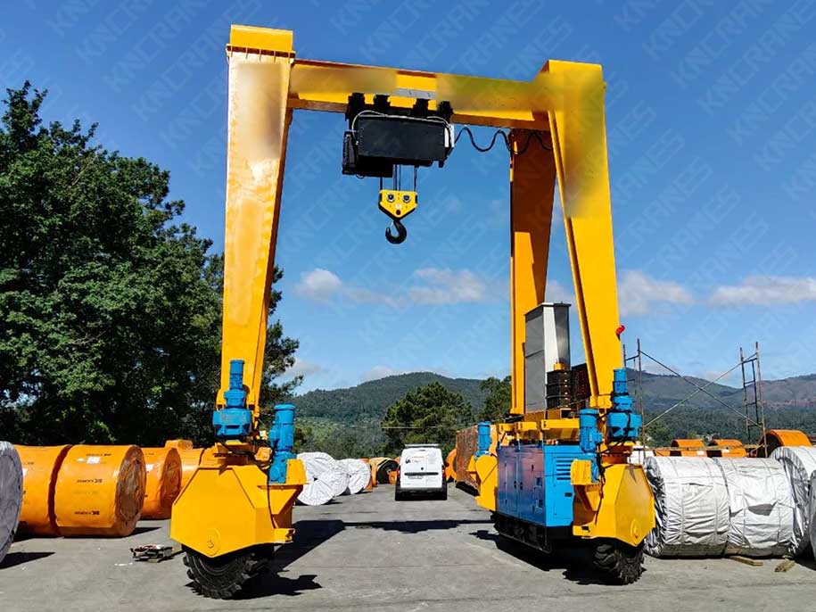 30 ton rubber tyred gantry crane handling conveyor belt reels in an outdoor storage yard in Spain