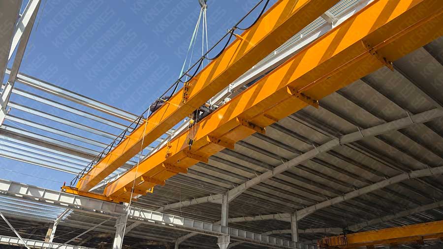5 ton double girder overhead crane being lifted into position on its runway