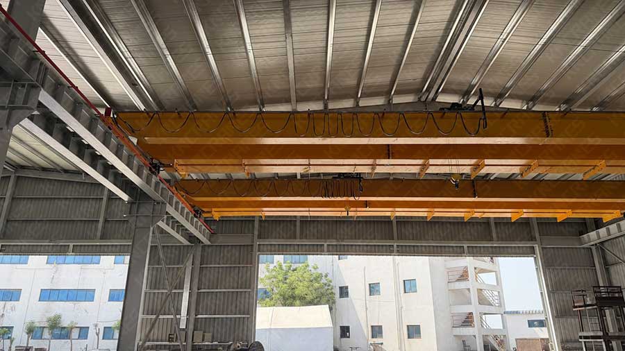Two 5 ton European double girder overhead cranes installed in a steel processing workshop in the UAE