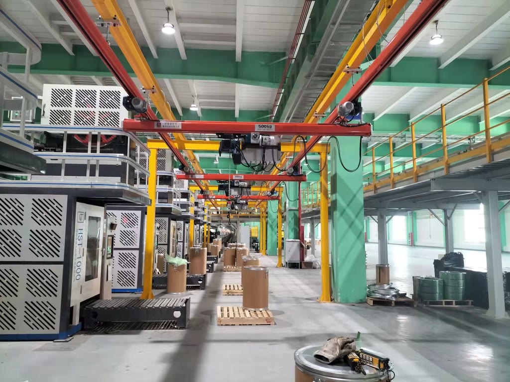 Single girder suspension crane with electric chain hoist above a production line